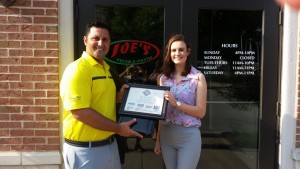 Joey Trupiano of Joe's Pizza Presents the Hall of Fame Award to Madeline Aherin of Dieterich High School
