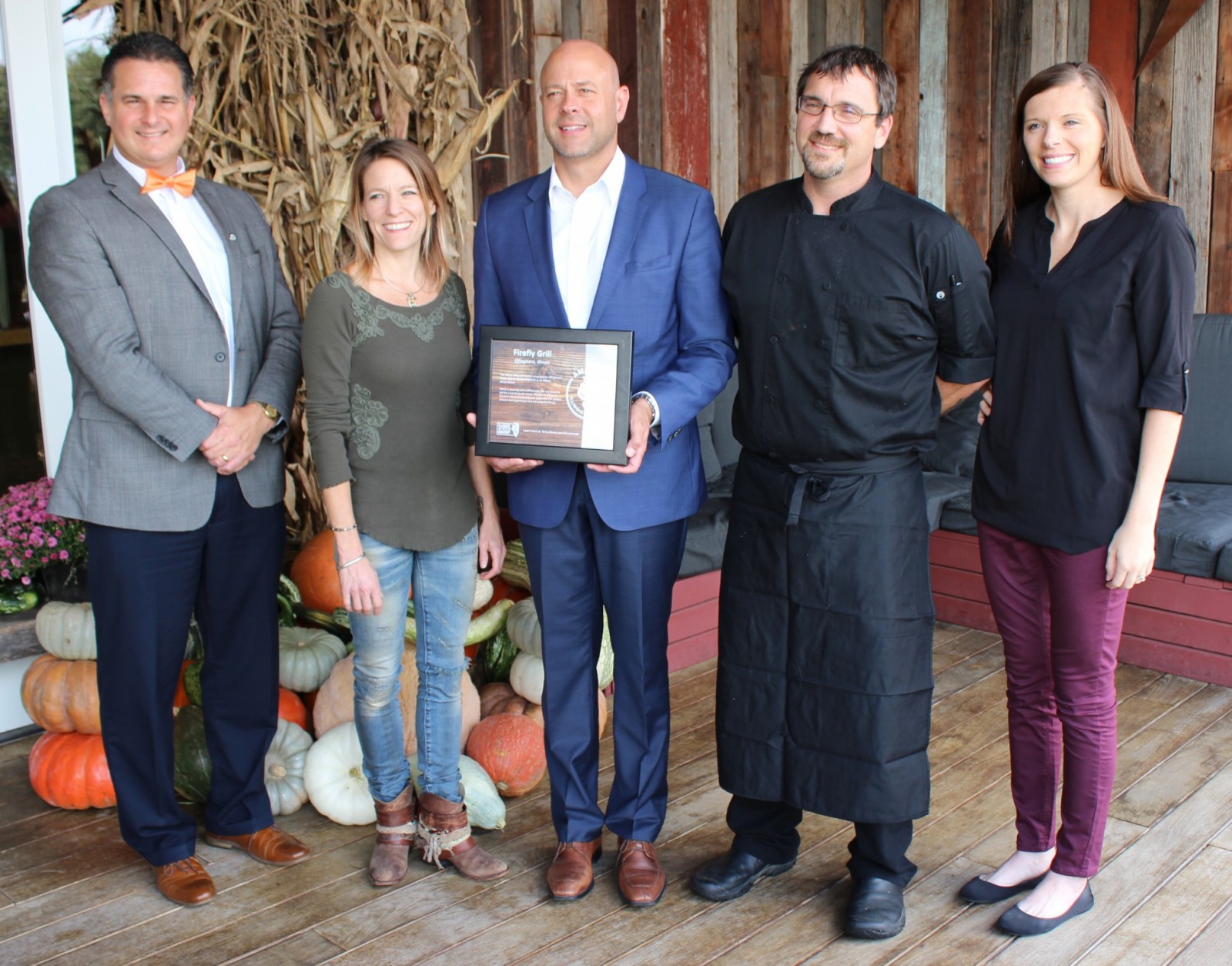 Cory Jobe officially recognizes the Firefly Grill as an "Illinois Maker" (Pictured L-R) Effingham Mayor Jeff Bloemker, Firefly Co-owner Kristie Campbell, Illinois Tourism Director Cory Jobe, Firefly Co-owner and Chef Naeel Campbell, Effingham Tourism Director Jodi Thoele. 