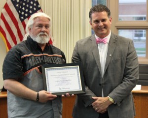 Legacy Harley Davidson Owner Paul Gutman receives the Business Appreciation Award from Mayor Jeff Bloemker 