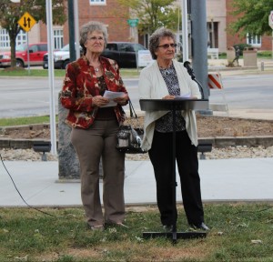 Arnetia Osborn and Bonnie Mellendorf speak at the flagpole dedication held on Tuesday.