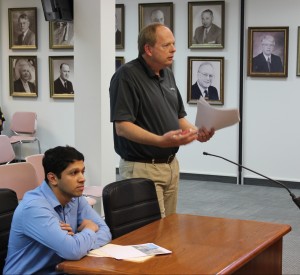 Arpit Shah (left) and Director of Economic Development Todd Hull (right) discuss improvements to America's Best Value Inn.